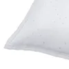 A close-up view of the corner of a white vacuum cleaner bag with a subtle dotted pattern. Produktbild-Vorschau