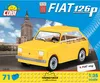 A yellow toy car model of a Fiat 126p is shown in front of a tall building and a blue sky with clouds. The image is a product advertisement. Náhled obrázku produktu