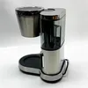 A studio shot of a coffee maker on a white background. Voir les images du produit