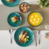 A table setting with various dishes and tableware. Produktbild-Vorschau
