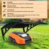 A robotic lawnmower is parked under a black canopy on a green lawn. Produktbild-Vorschau