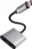 A close-up studio shot of a silver Mcdodo USB-C to 3.5mm audio adapter with a black braided cable. Náhľad obrázku produktu