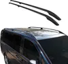 A pair of black roof racks is shown against a white background, with a partial view of a dark-colored van with roof racks installed in the lower portion of the image. Podgląd zdjęcia produktu