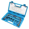 A valve spring compressor tool kit in its blue plastic case, with the lid open showing diagrams and specifications. Anteprima dell’immagine prodotto