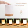 A hand touching a touch-sensitive LED lamp, with text and icons indicating adjustable brightness and touch control. Below, four images show the lamp at different brightness levels. Produktbild-Vorschau