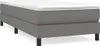 A studio shot of a gray bed frame with a white mattress. Produktbild-Vorschau