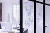 An office setting with drawings on a glass partition. Anteprima dell’immagine prodotto