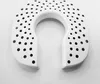 A white humidifier filter with many small holes, shaped like a horseshoe, on a white background. Anteprima dell’immagine prodotto
