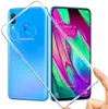 A clear protective case is shown being held over a blue Samsung Galaxy A40 smartphone. Produktbild-Vorschau