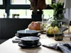 A table setting with tableware, bread, and fruit. Náhľad obrázku produktu