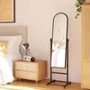 A bedroom scene with a bed, nightstand, and a full-length mirror. Anteprima dell’immagine prodotto