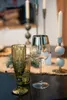 A close-up shot of wine glasses and candlesticks on a table. Podgląd zdjęcia produktu