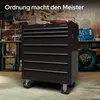 A black tool chest with seven drawers in a workshop setting. Náhled obrázku produktu