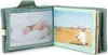 An open fabric photo album for children, showing two pages with photos of babies. Anteprima dell’immagine prodotto