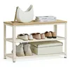 A shoe rack with various shoes and a handbag on top. Náhled obrázku produktu