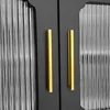Close-up of two cabinet doors with gold handles. Anteprima dell’immagine prodotto