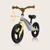 A balance bike with measurement indicators for handlebar height. Produktbild-Vorschau