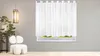 A white sheer curtain hangs over a window in a room with a modern chair and a bonsai tree. Produktbild-Vorschau