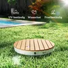 A circular wooden shower base sits on a green lawn next to a swimming pool, with sun shining. Produktbild-Vorschau