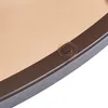 A close-up view of the edge of a round table with a brown glass top and a dark gray metal frame. A small clear suction cup is attached to the frame. Náhľad obrázku produktu
