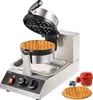 A commercial waffle maker with a freshly made waffle, jam, and berries on the side. Anteprima dell’immagine prodotto