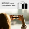 A person holds a smartphone horizontally to take a picture of a sunset over a body of water with a city skyline in the background. The top part of the image shows a graphic of a screen protector being applied to a phone. Podgląd zdjęcia produktu