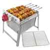 A stainless steel grill with meat and vegetable skewers on it, with an extra grill rack next to it, on a white background. Produktbild-Vorschau