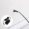 A close-up view of a power adapter and cable connected to a white surface, likely the back of a product. Podgląd zdjęcia produktu
