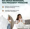Two women are shown with white bedding. One woman is holding up a large white sheet, and the other is smelling a piece of white fabric. Produktbild-Vorschau