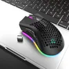 A black gaming mouse with RGB lighting is placed on a laptop keyboard. Produktbild-Vorschau