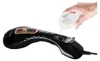 A hand is pouring water into a handheld garment steamer. Podgląd zdjęcia produktu