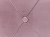 A close-up view of a tufted fabric surface with a central button. Náhled obrázku produktu