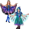 Schmetterling Kostüm Lilly für Kinder in Lila-Blau mit Kleid, Flügeln und Fühlern neben einem farbenfrohen Pfauenkostüm. Produktbild-Vorschau