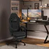 A gaming chair and desk setup in a room. Produktbild-Vorschau