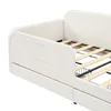 Close-up of a white upholstered daybed with a slatted wooden mattress support and storage drawers underneath. Podgląd zdjęcia produktu