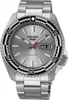 A close-up studio shot of a silver Seiko 5 Sports watch with a gray dial and a black and white bezel. Voir les images du produit