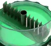 A close-up view of the cutting mechanism of a garlic press. Produktbild-Vorschau