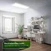 A modern home office setup with a desk, computer, and shelves, illuminated by a ceiling light. Produktbild-Vorschau