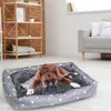 A dog is lying on a dog bed in a living room. Anteprima dell’immagine prodotto