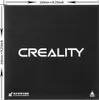 A black 3D printer build plate with the Creality logo and dimensions printed on it. Náhľad obrázku produktu