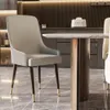A modern dining room setting with a chair and table. Produktbild-Vorschau