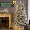 A decorated Christmas tree and fireplace with warm white lights. Podgląd zdjęcia produktu