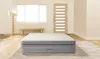 An inflatable mattress is shown in a room with a window, a door, and a rug. Produktbild-Vorschau