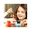 A young girl is playing with a set of cat figurines and accessories, including a cat tree, a small house, and food bowls. Anteprima dell’immagine prodotto