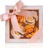 Geschenkbox mit vier apricote Baderosen Voir les images du produit