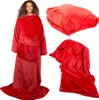 A woman wearing a red fleece blanket with sleeves, and two folded views of the blanket. Náhľad obrázku produktu