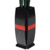 A black vase with red accents holding green stems, likely flowers or decorative elements. Náhľad obrázku produktu