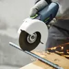A person wearing gloves is using a Festool angle grinder to cut a metal rebar. Produktbild-Vorschau
