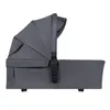 A side view of a gray baby bassinet with a canopy. Produktbild-Vorschau