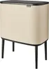 A product shot of a Brabantia Bo Touch Bin trash can with three compartments, shown from a three-quarter angle. Anteprima dell’immagine prodotto